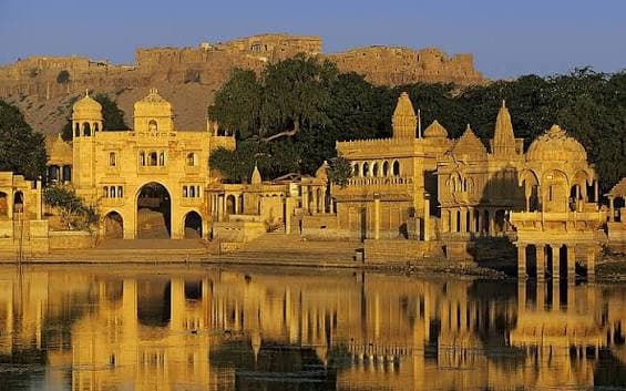 Golden hour sunset over Thar desert and sandstone buildings